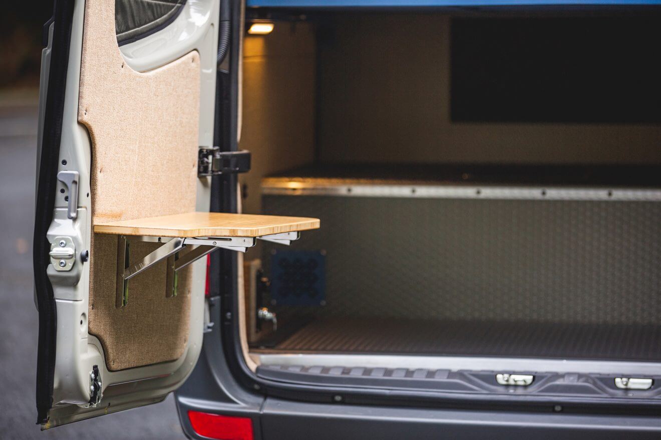 custom van conversion land yacht 2019 mercedes benz sprinter 170 4wd rear garage flip up table