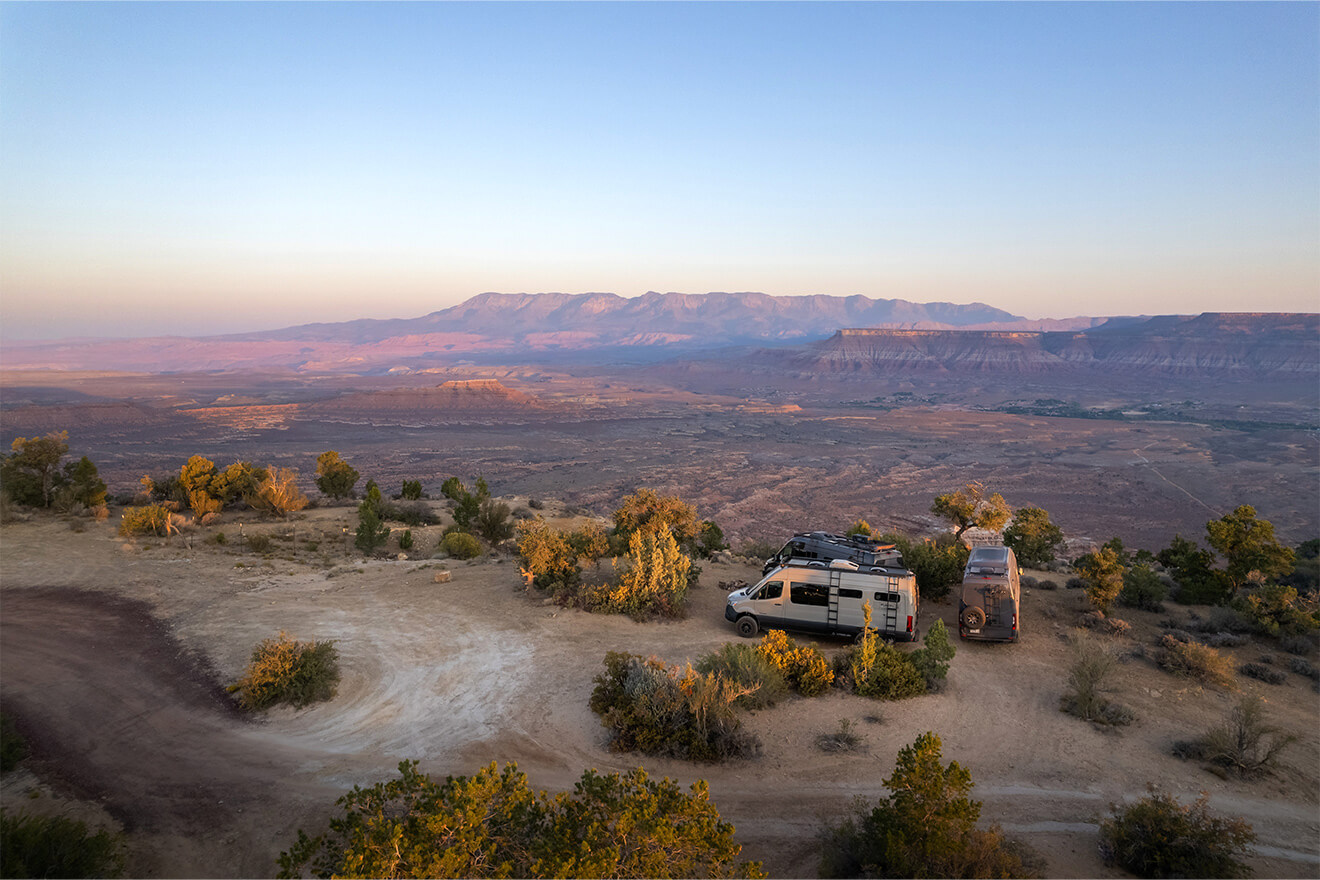 Adventure vans on the trail at sunset