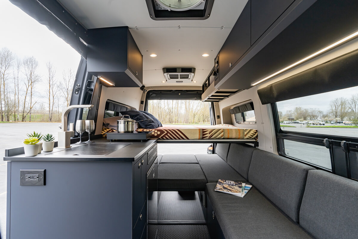 custom van conversion Joint Venture Van 2021 mercedes benz sprinter 144 4wd seat two sleep four interior cabin passenger slider galley kitchen