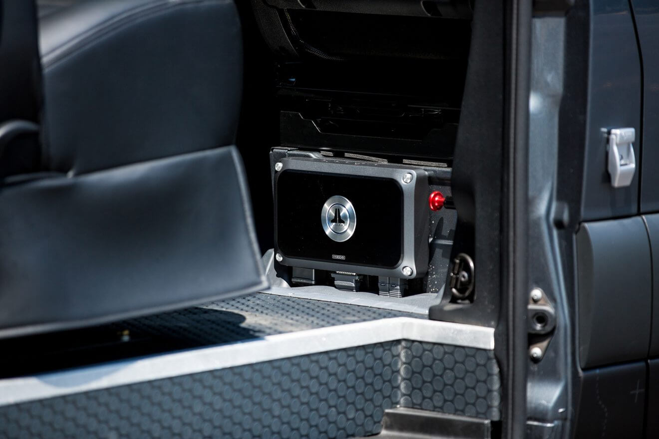 Detail of JL Audio amp inside custom off road sprinter van