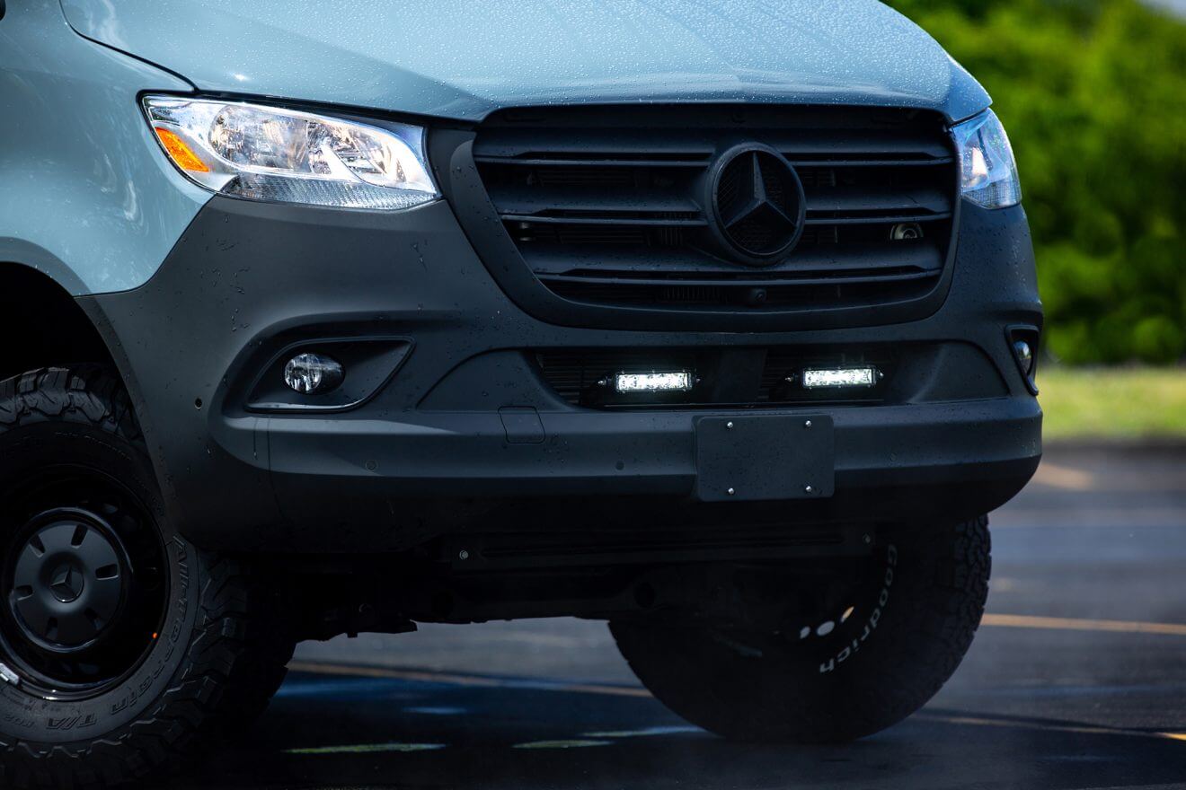 Custom off road Mercedes 144 off road sprinter van in sunny parking lot