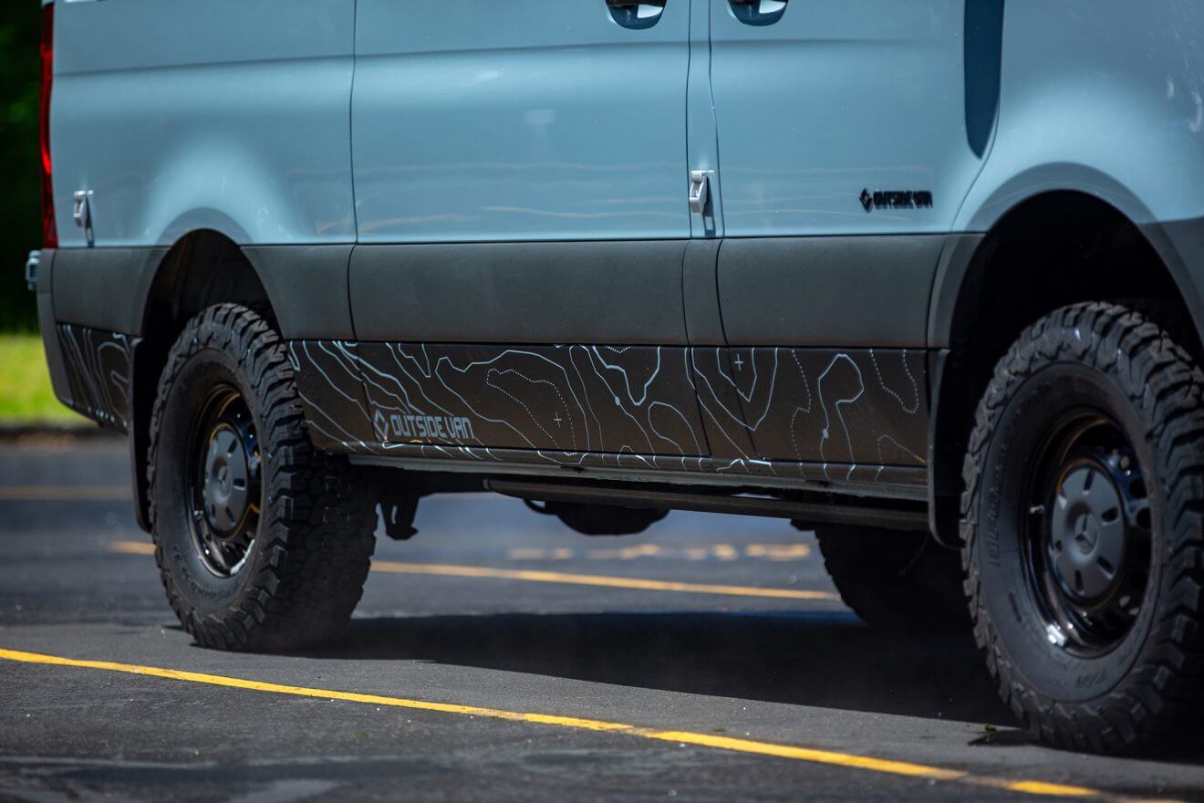 Custom off road Mercedes 144 off road sprinter van in sunny parking lot