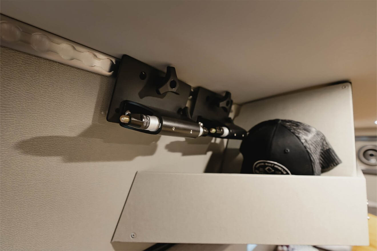 Mac tracks with bike fork utility mounts near an Exoskeleton open overhead cabinetry