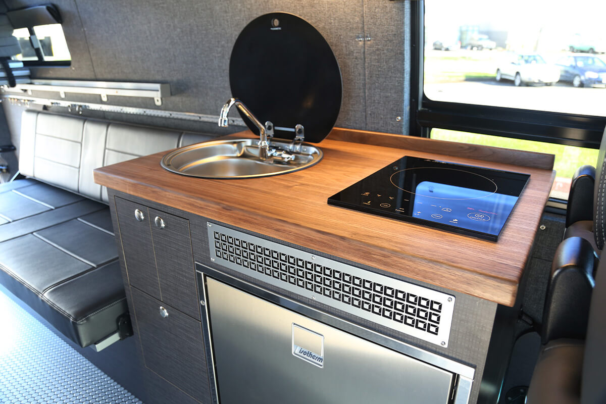 alpinista is a 170" custom Outside Van for camping with family or friends. seats 5 sleeps 4 with gally and exterior shower