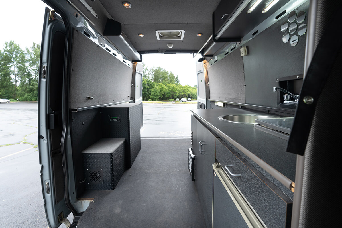 Interior of custom 2005 Dodge camper van built by outside van in Portland Oregon