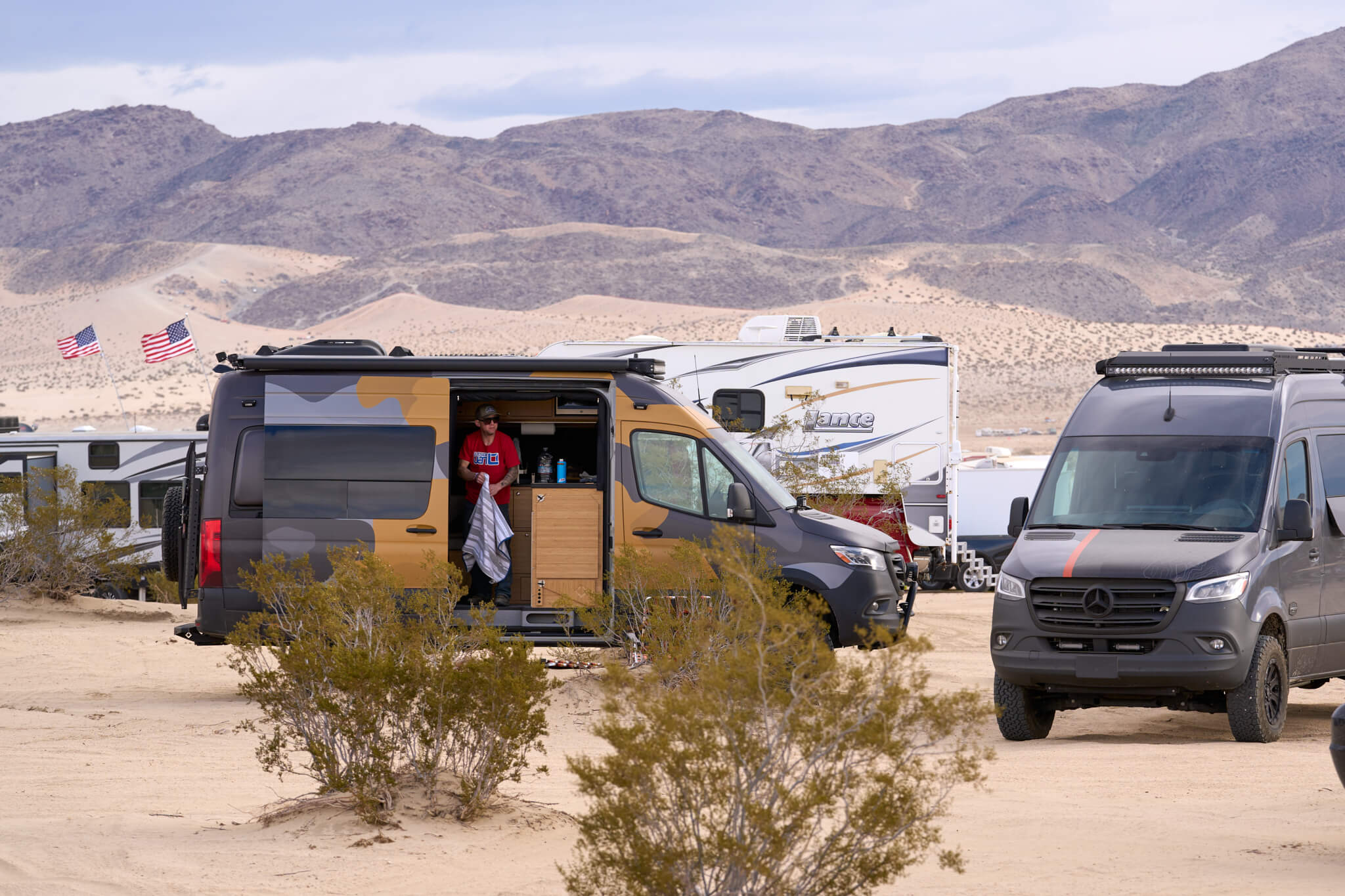 Two Outside Van's parked in the camping area of King of the Hammers