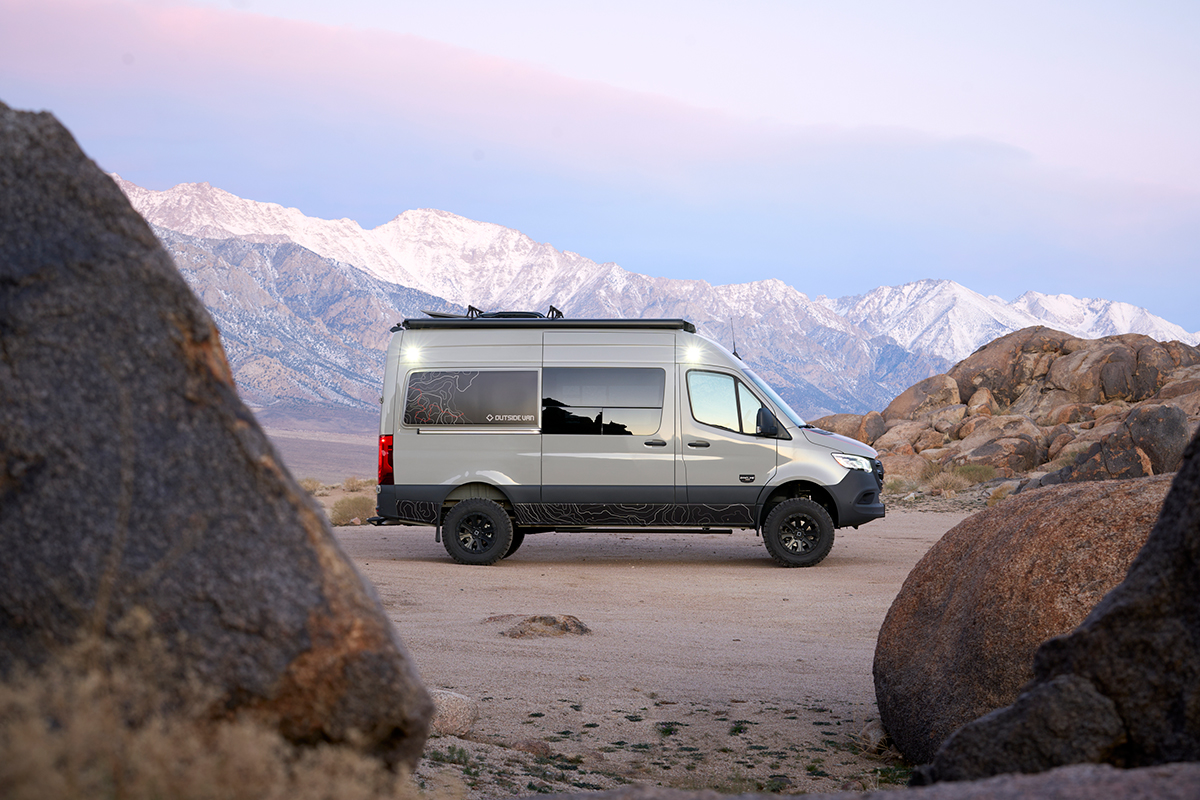 Outside Van Syncline van in a desert mountain scene