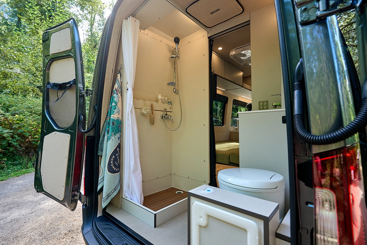 Interior Outback Washroom with high top shower on the Outside Van Parks