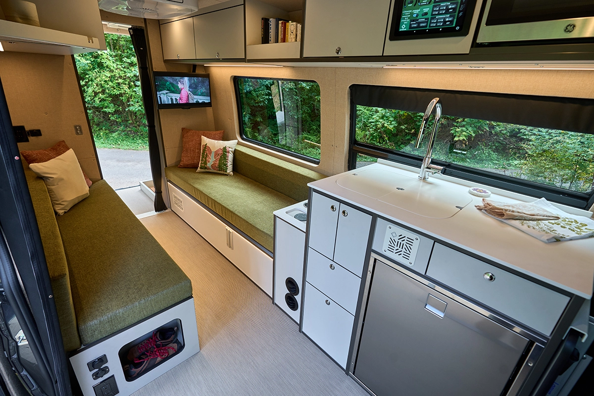 Outside Van Parks interior kitchen and bed view