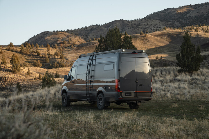 Outside Van Approach adventure van in a outdoor landscape scene.